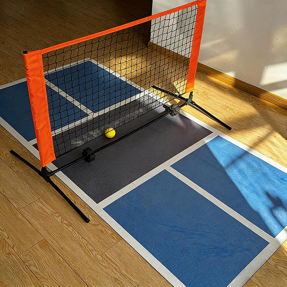 Duo Court on a wood floor with a pickleball in the kitchen